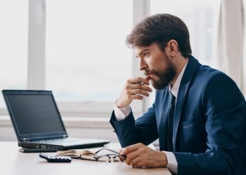 open laptop office light room window businessman model suit open laptop office light room window businessman model suit. High quality photo